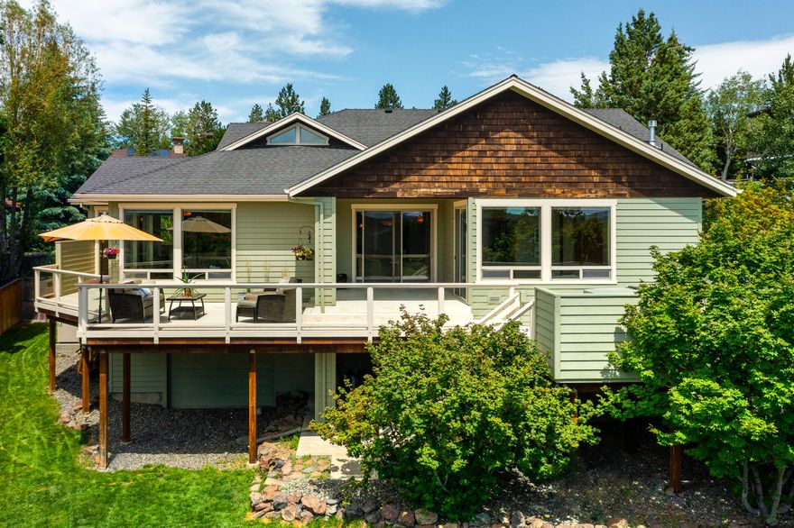 This is the family dream home!  4 bedrooms 3.5 bath with a huge open living concept on the main level with the kitchen, family and dining room all flowing together perfectly.  Master suite is just off of the family room with access to the large deck with amazing views of the Three Sisters and Mt. Bachelor.  Go upstairs for 3 bedrooms and a large loft which is perfect for entertaining. Go downstairs for even more space. Potential for an office or bonus room. Then there is another garage downstairs that has been converted into more of a bonus room, could be used as a garage as well to make it 5 garage spaces.  This is a rare find in a perfect location.