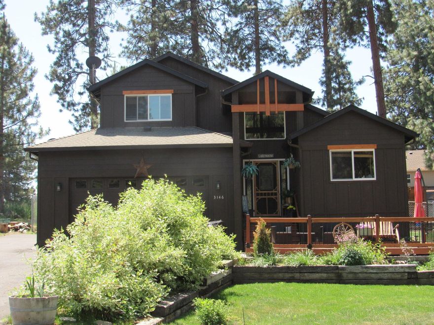 Awesome home in the pines with access to Agency Lake. 3-bedroom 2 bath 1902 sq ft home with primary bedroom and all living area on first floor.  2 bedrooms and 1 bath on upper level. Very nicely landscaped with backyard fenced for children or a dog.  Lots of flowers ---even a raspberry patch. Nice kitchen and dining with a patio off the living room. 2 car garage with room enough for cars and toys & has a paved driveway. Oregon Shores has a great common area for their owners on Agency Lake, with 17 acres with R.V. spots and a gazebo, bathrooms, and a RV dump station. This makes for a great private campground for the owners.