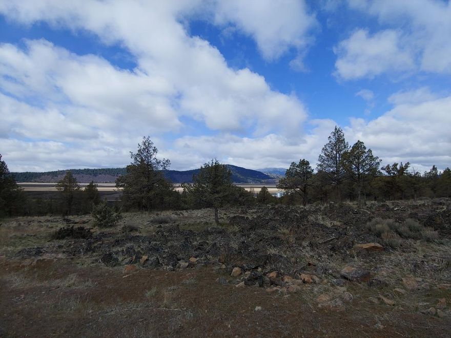 Almost an acre at the Running Y Ranch! And what a view of the ranch this home site has to offer! There are mountain and valley views with sunsets casting a dramatic panorama over the Cascades. The ranch lands change colors with the seasons, always back lit by the mountains and blue skies . Buy now and build later. Join the lifestyle at the Running Y.