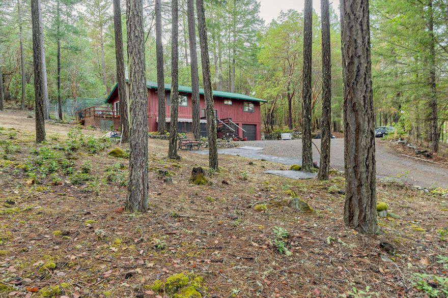 Back on Market.  No fault of property. In the heart of the wine country just 15 minute to the town of Jacksonville. This secluded property minutes from Cantrall Buckley park and BLM.  The 2160 sf 3 bedroom, 2.5 bath home is situated on a beautiful forested 5.56 acre lot. Recently updated top to bottom including exterior stain, new decking and entry, enclosed patio on slab, new heat pump, well pump (5 to 7 GPM) , new flooring throughout, updated bathrooms, new water heater and aqua system, range oven, garbage disposal, microwave, kitchen counters.  Newly painted metal roof.  2 car attached garage w/ openers. Possible two family set up. This property is truly special and is turn-key - no surprises.