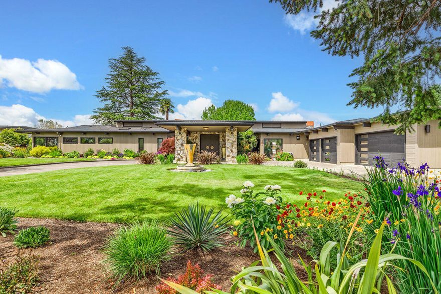 Stunning Mid Century Modern w/Architectural style! High vaulted ceilings & wood beams. Floor to ceiling windows to take in the views of RVCC Golf Course & Mt Views. Prime location overlooking the 14th fairway w/a private setting. 6123 SQ FT on .74 acre lot w/4 car garage + separate golf cart garage next to the golf path. RV parking w/portico. Beautiful & private landscaping. Home & property feels like something out of Palm Springs. Lg island kitchen w/dbl ovens & dbl warming drawers, sub zero refrige/freezer, pantry. Granite counters, many stone & wood floors, 2 grand stone fireplaces, 4 en-suites & private office w/exterior door. Lg primary suite w/bathrm & many closets & storage. Formal dining rm & breakfast rm. Great rm, family rm, media/rec rm downstairs w/full suite. Spacious mud rm/laundry rm. Backyard has its own oasis w/ heated pool & wading pool w/cement bridge over the pools. Mini outdoor kitchen w/BBQ. Spa & lg open patio areas. It has it all!