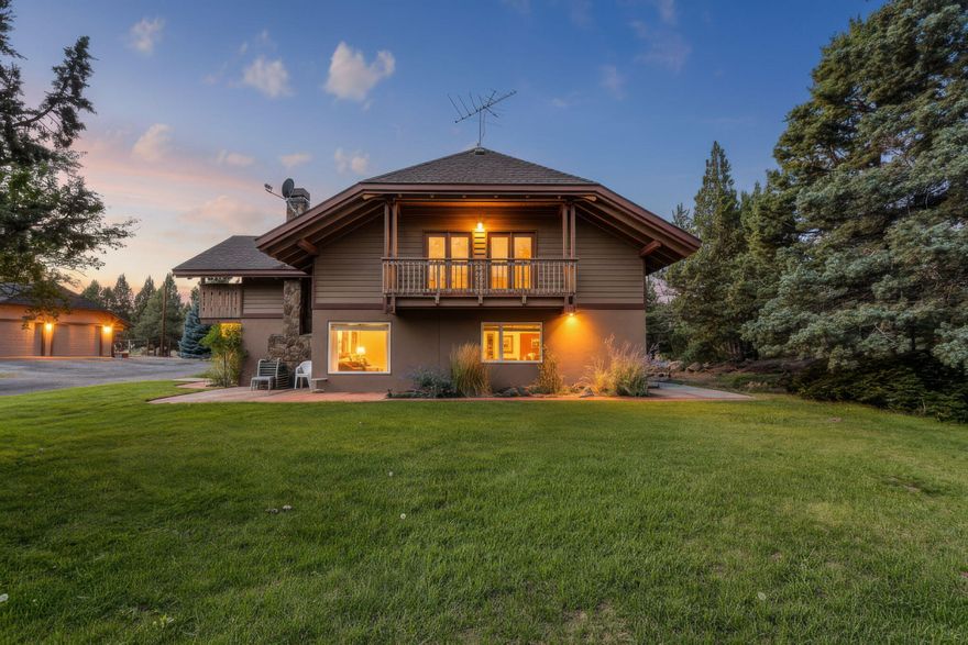 Escape to your own sanctuary on 9.7 acres of fenced, private land (+5.5 acres irrigation rights!) just minutes from the conveniences of Bend. You can enjoy the peace of a country property with easy access to Central Oregon's amenities and outdoor recreation opportunities! This property offers a seamless blend of open country living that boasts a sparkling pond, barn structure, and a detached oversized garage with dwelling space area perfect for an office, art studio, or potential guest quarters. The European style home was thoughtfully designed with custom features, including stunning open-beam ceilings, radiant floor heating for cozy, efficient warmth, flexible living space with ample room for guests, and multiple private balconies to enjoy the peek-a-boo mountain views through the trees in the peaceful, serene setting. Home is well-insulated to keep the spaces comfortable throughout the seasons. Property is ready to be your next forever home!