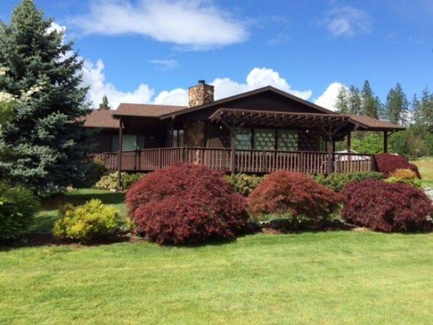 Breath-taking views of the eighth fairway...you could while away many hours, drink in hand, on the wide covered veranda facing lush greens that someone else takes care of. Beautiful 2128 sq/ft home, built in 1988, two bedrooms/two baths with lots of wide open spaces. Fabulous place to entertain family and friends with a huge great room showcasing wall to wall to wall picture windows and sliding glass doors. Gorgeous stone gas fireplace offers cozy warmth on cool evenings. Kitchen features tons of storage and an area for a home office. And just steps away, a wet bar! Master bedroom is spacious, overlooking the greens. In addition to the over-sized finished two car garage, there is also a golf cart garage, which could double as a shop. AND there's a space to park either a boat or all-terrain vehicle. And that still leaves an extra-long RV garage as well. Everything you need on this quarter-acre lot in a quiet neighborhood just minutes from downtown Grants Pass. Who wouldn't want to live