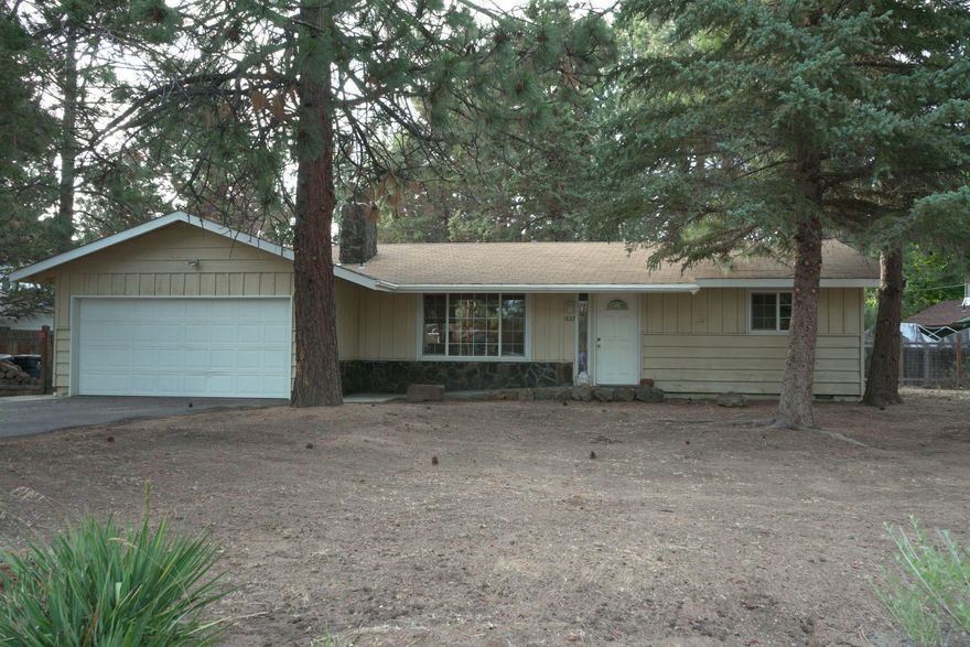 Potential abounds on this .3 acre, corner lot ranch situated in the heart of Larkspur. 3 bed/2 bath with private master providing 1,064 SQFT of single level living! Finish the extra space out back for a man cave/she shed/office or park all your bikes for your Central OR Adventures! Finish the garage conversion for more space or simply bring it back as a nice two car for covered parking.