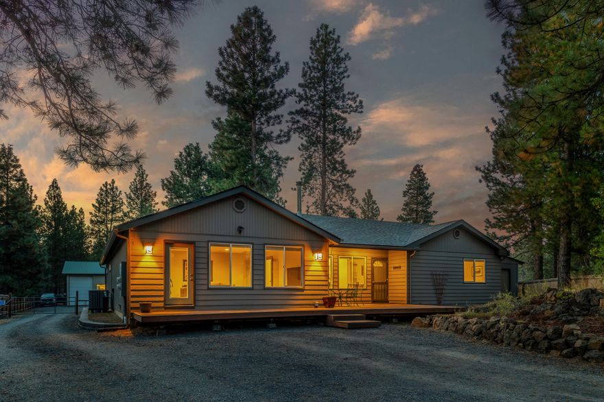 Remodeled in 2021 this ideal single level four bedroom home on a beautiful flat lot surrounded by mature pines is an amazing retreat.  This home is a perfect place for kids an accompanying 2400 sf solar powered two story shop can house all your toys.  This home has everything you find in an acreage property but close to town and a manageable easy to maintain fully fenced yard.  A 960ft office / dwelling with it's own separate septic is a fantastic touch for out of town guests, extended family, or additional income.