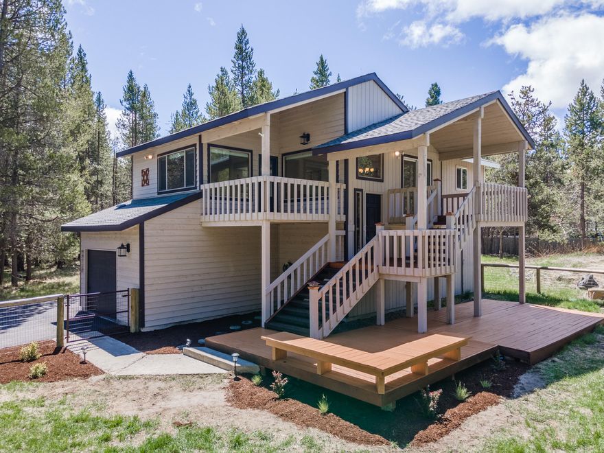 PRICED TO SELL QUICKLY. This home is wonderfully located just across the street from the Deschutes River and surrounded by old growth timber. There are 3 bedrooms including 2 master suites and 2 bathrooms on over half an acre with a large fenced yard. The downstairs master bedroom has a beautifully renovated master bath with tiled shower and quartz countertops. Enjoy peek a boo views of the Deschutes River from one of the many outdoor living spaces including two covered decks. The home has wonderful privacy and plenty of room for RV parking. Make this wonderful property your dream vacation home or live all year long in the quiet riverside community.