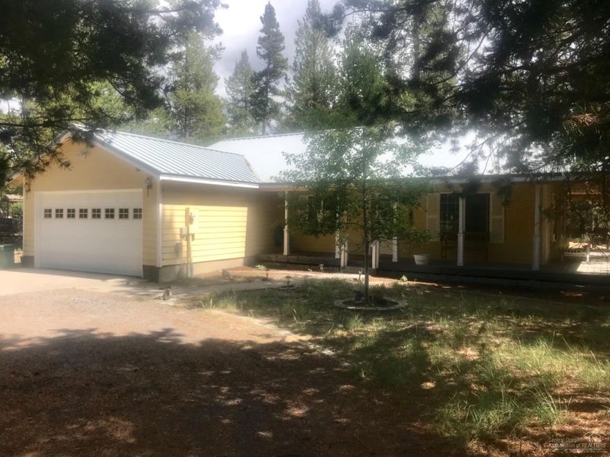 3 Bedroom 2 Bath Frame Home just Outside of City Limits for Peace and Quiet. This 1488 Sq Ft Home was Built in 2001. Open Floor Plan, Living Room, Kitchen with Breakfast Bar and Dining Area, Extra Wide Hallway, Utility Room with access to Attached Double Car Garage, Large Master Bedroom with Master Bathroom to include Soaking Tub and Shower Stall. French Doors out Dining Area to Wrap Around Covered Deck with Recessed Lighting to the Heated Swimming Pool. Additional Storage Building with Ecowater Filter System. Metal Roof and Fenced Backyard.