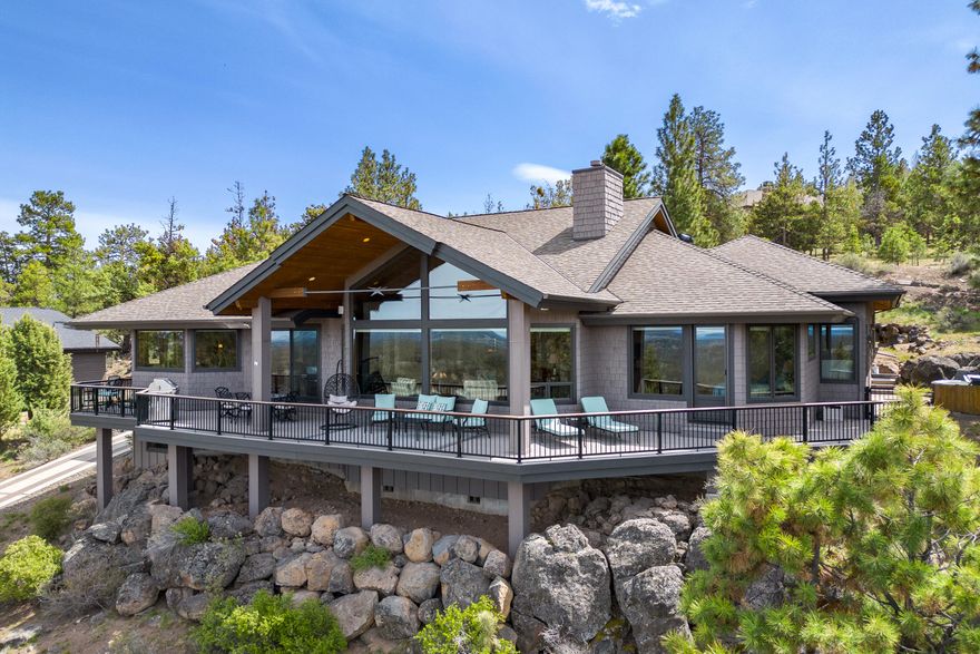 Stunning CASCADE VIEWS from this Awbrey Butte SINGLE LEVEL home with a 3-car garage! Custom features with an open floor plan, vaulted ceiling, stack stone gas fireplace w/built-ins, dining room, office w/ built-in desk & a bonus/media room. Kitchen w/Dacor stainless steel appliances, double ovens, 5 burner stove top, slab granite counters, farm sink, Medallion cabinets & pantry.  Primary suite has views, a gas fireplace & door to the deck.  Primary bath has dual sinks, tile counters, jetted tub, huge tile shower, & walk-in closet with built-ins.  Home features include Sierra Pacific windows, central vac, AC, solid fir doors, Hunter Douglas cell shades, radiant heat in primary bath/kitchen & surround sound. Garage has workbench, built-in storage cabinets & attic storage space. Waterfall feature, 800 SF of composite decking & a patio w/ a hot tub. HEATED DRIVEWAY (paved strips) with 2 parking spaces & a flat driveway at the garage entrance.  Plenty of storage under the house.