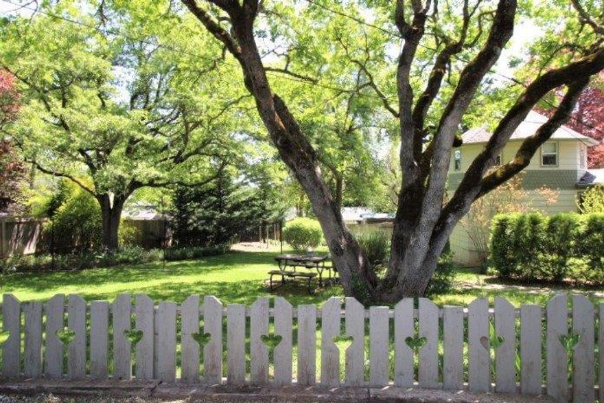 Super sweet Jacksonville retreat! Close to all of the city conveniences. This 3bd, 2bth w/ bonus room, has 1901 sq ft on .48 acre lot right in town. The park like setting has a 21 X 21 studio, studio was remodeled in 2015. Property also features a detached shop/garage and oversized carport. Home has many upgrades mostly remodeled in 2010. Cozy up to the gas fireplace insert in the winter months and enjoy the screened in sun room during the rest of the year! The mature landscaping is breathtaking especially during spring with all the tree blossoms and garden flowers. Garden area includes a small orchard. Enjoy the Koi Pond off the front porch. Enter on the paved circle drive.