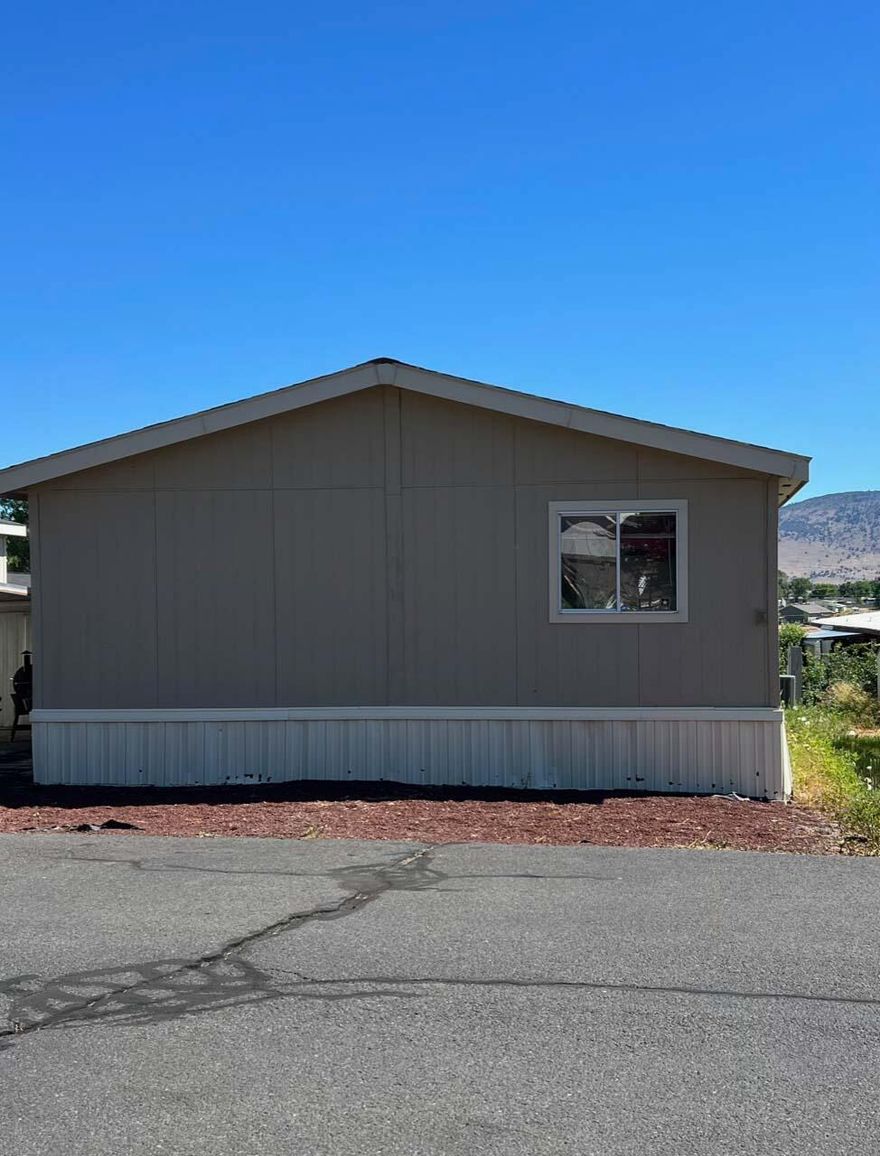 Well-kept manufactured home in Villa West Mobile Estates with 1400 square feet of living space, large kitchen and dining area, separate laundry area, 3 full bedrooms, 2 bathrooms, and office/den.  This is a great floorplan with the primary bedroom/bath on one end and additional bedrooms on opposite end.  In the past three to four years, both inside and outside have been painted, new carpets were installed, and new furnace and A/C.