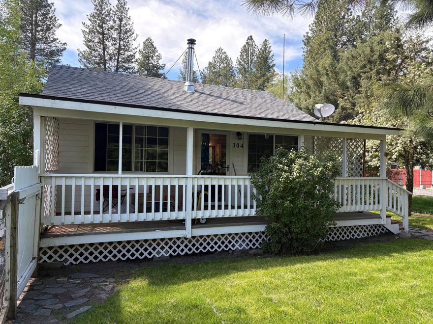 Peaceful haven with view of Chiloquin Ridge.  1993 built cottage with covered front and back decks.  Compact home boasts reasonable utilities.  Walking distance to Williamson River or use boat launch approximately across street from the Dollar General.  Fenced yard with 2 sheds, carport and established landscaping.  2 pear trees, black caps, strawberries and perennials. House had new roof in 2024, and shed reroofed 2025.  Sewer/water flat rate currently $80/month. ''Owner loves their neighbors.''