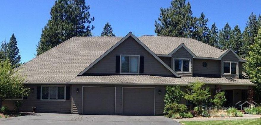 This is a beautiful home tucked in the back of Woodside Ranch and backing to public lands. Set off the street on a serene 2.21 acres dotted with ponderosas and junipers, this estate is quiet and peaceful. An extensive remodel of the downstairs gives the home an old colonial feel with top end amenities. Mt Bachelor is framed perfectly from the kitchen and backyard. The deck stretches across the length of the home out back. For horse lovers, this property is perfect with a back gate adjoining public lands.