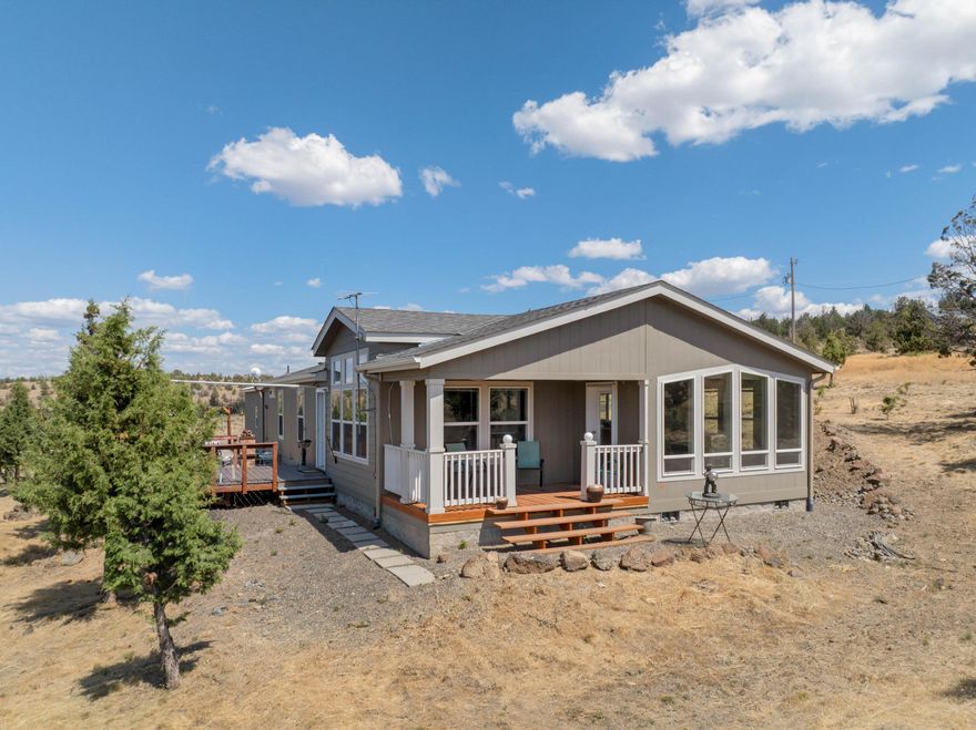 Enjoy peaceful country living with this lightly lived-in 3-bedroom, 2-bath home on just under 2 acres in beautiful Prineville. Built in 2020 and only used seasonally, this 1,620 sq ft home offers like-new condition and modern comforts throughout. Perched on a high lot, you'll love the stunning panoramic views of the Cascade Mountains, including the Sisters and Mt. Jefferson. Just a short drive to Prineville Reservoir, this is an ideal location for those who love nature, views, and space to roam.