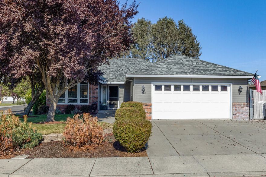 Lovely corner lot home in New Haven Estates adjacent to Blue Grass Downs. Three bedroom, two bath. Open floor plan with lots of light. Newer laminate flooring through-out with tile in bathrooms. Gas fireplace in family room. Portable Island with granite counters in Kitchen, Tile counters in Bathrooms. Finished Garage with Attic pull down stair access. Private back yard with Deck. RV Parking.