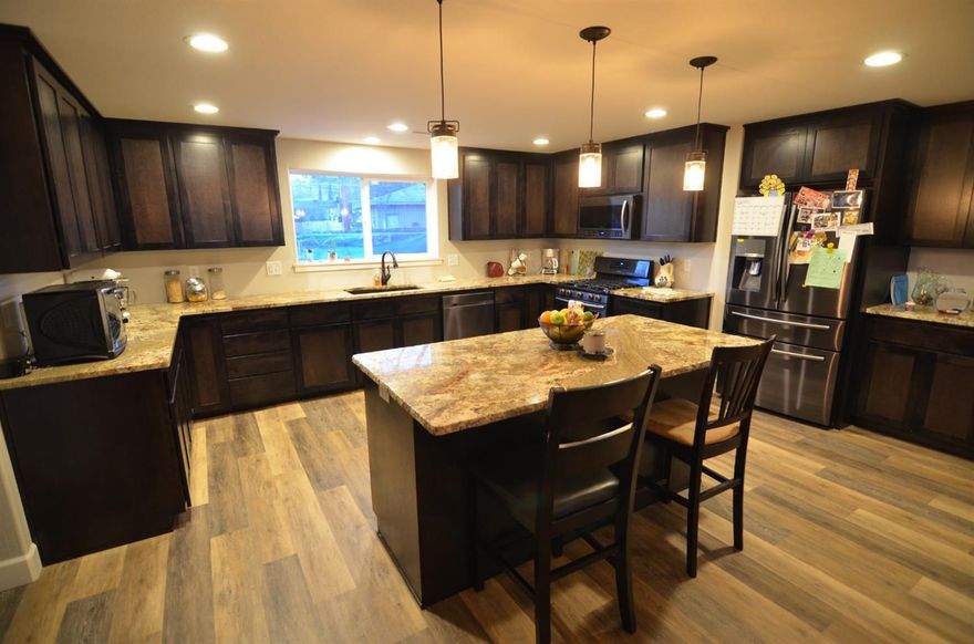 Gorgeous large Home with so many wonderful possibilities! The interior and exterior were fully updated in 2017 which cost the seller over $240,000. 4 bedrooms, 3 bath, 3518 sqft. Incredible Master Bedroom upstairs could actually be a Mother in Law set up, or potential Adult Care home. Extra wide hallways, Jack & Jill bathroom downstairs to 2 bedrooms with walk-in closets. Kitchen is very spacious, lots of counter space & storage. Wonderful in-door laundry room with additional storage. Home has been beautifully remodeled & updated with all new granite counter tops, new paint, windows & much more. This is not a drive by!! Must get inside to recognize the potential.