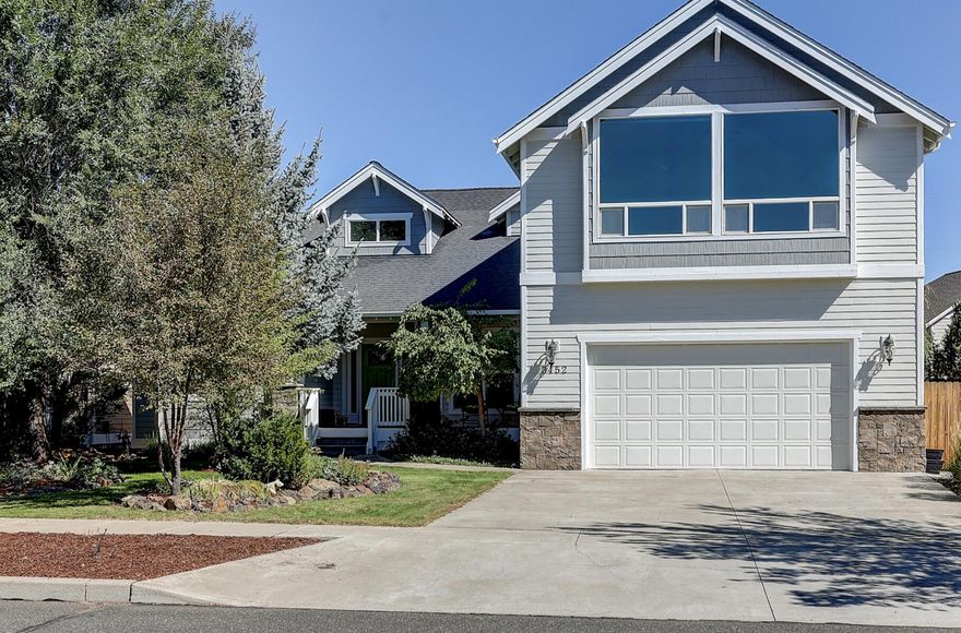 Beautiful larger home on a cul-de-sac in NE Bend's Sandalwood neighborhood. You'll love the inviting entry, vaulted ceilings with exposed wood beams, abundant natural
light and open floor plan. Rich brown hardwood floors/accents are a perfect contrast to the crisp white interior, creating a true NW modern feel. The spacious primary bedroom is on the main level and includes a master bath with double vanity, large closet, tiled shower and jetted tub. The main level also features a private office, laundry, and garage access. The attractive staircase takes you to two additional bedrooms, full bath, and a generous bonus room with gas fireplace that can host an almost unlimited amount of possible functions. Not be be missed is the sanctuary backyard with multiple decks, stone walk ways, varied foliage, and large tranquil water feature.