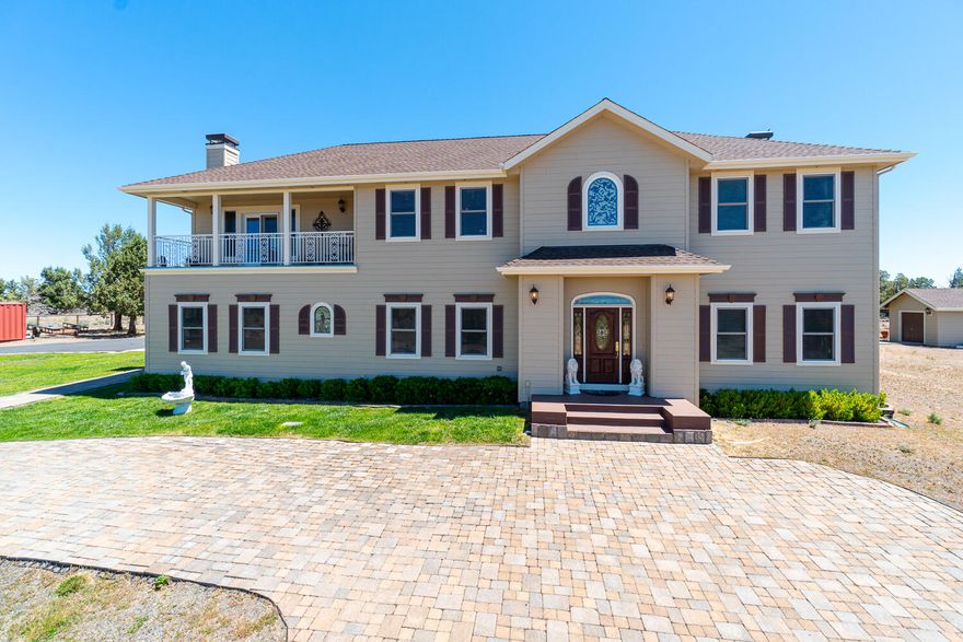 Must-see home w/stunning, unobstructed Mtn views clear to Mt. Hood. Nestled on a flat 4.94 acres on the edge of Crooked River Ranch. Vaulted entry w/sweeping curved staircase, custom details & Travertine flooring that extends into open Chef's kitchen. Granite ctrs, Cherry cabinetry, lg island, coffee bar, cooktop & a dbl oven. Main level lives large w/10' ceilings, formal dining, 2 family rooms, laundry rm w/storage & sink, 2 half baths & bar area.  Primary suite upstairs just off the main staircase w/ vltd tray ceiling, gas fp + private bath w/tile floors & shower, jetted soaking tub, walk in closet, & dbl vanities w/ granite ctrs. 2nd suite offers stunning views from private balcony & shares full bath w/step in shower. 4th br also has a full bath w/step in tiled shower + its own balcony. Butler's stairs lead back down to kitchen & den/sitting/game room. 2 wood burning & 2 gas fireplaces & only 1 or 2 have been used. Miles of horse trails & just 2 miles from Steelhead Falls!