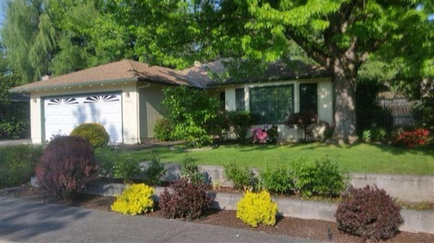 Perfect home in desirable East Medford neighborhood. This beautifully landscaped 3 bedroom, 2 bath home features an open floor plan, attractive brick fireplace, hardwood entry, tile in kitchen and bath, walk in closet in master bedroom and french doors leading out to a large, covered back patio. In addition to an oversize two car garage with a deep sink, there is also deep, full size RV parking. While you're relaxing in your very private back yard you'll know this is the one to call home!