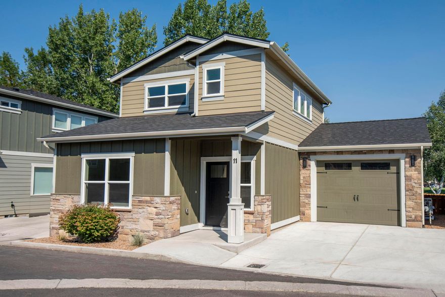 Ask about incentives when working with our preferred lender! Owner carry terms also available. Brand new home on The Greens in Redmond. From the spacious kitchen with stainless steel appliances and tile backsplash, to the luxury vinyl plank flooring and quartz counters throughout, this home delivers a high end feel, and is of obvious quality. You will enjoy main level living with the primary suite on the ground floor. Upper level provides another bedroom, full bath and large loft. Large windows on both levels overlook The Greens golf course and pond.  The back patio offers a shaded retreat to watch the golfers or just sit back and relax. This home is super efficient with on demand water heater, and minisplits for zoned heating. Fantastic location just minutes from the airport and bustling downtown Redmond. Make this Talmage Construction home your new home, or your Central Oregon base camp.