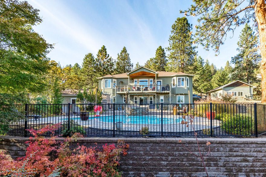 Location! Location! Location! This property sits on the desirable street of Tami Lane. Just 2 miles from downtown historical Jacksonville. This traditional country home is 1.73 acres of professionally landscaped and gated property. The main house over looks gorgeous views of Mt. Mcloughlin and city lights in the evening. Just over 3,000 sq ft with 4 bedrooms and 5 bathrooms. Newly renovated kitchen with beautiful marble countertops and ceramic tile backsplash in 2021. New hardwood floors and carpet in the bedrooms. Wood burning fireplace. Master is located on the main floor.  New Water heater, New well pump, new Septic. Guest house is unattached with it's own private garage. 1 bedroom, 1 bath and is 624 sq ft. This could be a perfect set up for an airbnb if desired. Over looking the mountain views is a private in ground heated pool and spa and  rock fireplace. Surrounding the property are a variety of fruit trees and a seasonal creek. A must see in person property.