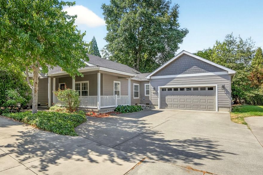 Come tour this lovely 3BD/2BA single level home in the Twin Creeks community! Purchase FULLY furnished for the same price! Maintained with excellence from top to bottom & move-in ready. In 2022, the majority of the siding was replaced & the exterior tastefully repainted, with new fixtures to top it off! The extended open floor plan beckons your cozy holiday gatherings & offers enjoyment of the living room gas fireplace throughout. Vaulted ceilings. Oak hardwood flooring. Well-appointed kitchen w/skylight over center island/bar, granite counters, custom cabinetry & stainless steel appliances. ALL appliances new as of 2022 & included in the sale! Guest wing separate from private master suite at rear. Laundry room leads to two-car garage. Covered front and back porches to enjoy Southern Oregon's mild weather year-round. Residents love this vibrant & peaceful community for its scenic walkability, parks, and shops!