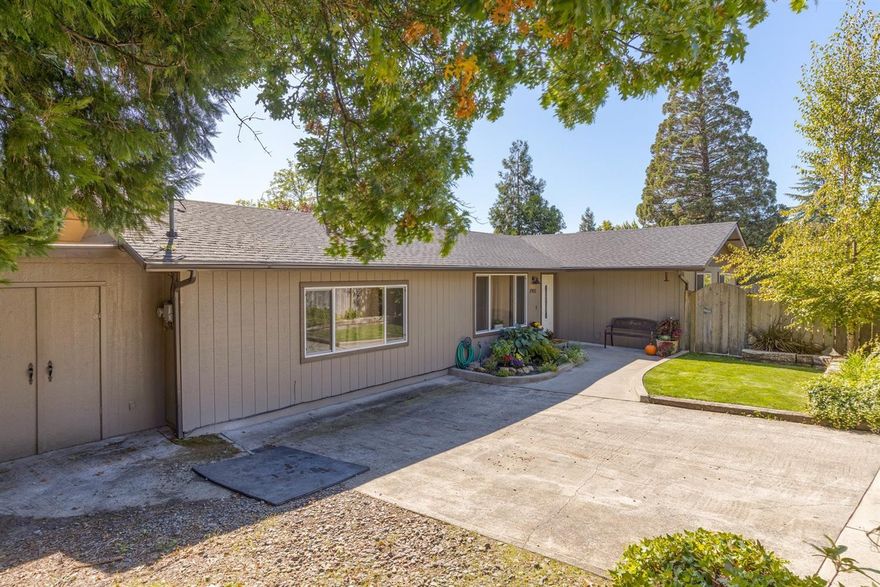 Great location in NE Grants Pass; close to shopping, restaurants and town. A spacious 3 bedroom, 2 bath home with 1728 sf. on a nice corner lot location on .18 of an acre. Family room/den is great place to gather with friends and family and relax. Bathrooms have been updated with new vanities, lighting and flooring. New carpet has been installed. Attached shop is 14x17.5 and is perfect for storage/hobbies. Mature low maintenance landscaping with water feature. Covered patio and brick fire pit. Put this one on your list to show. District 7 schools.