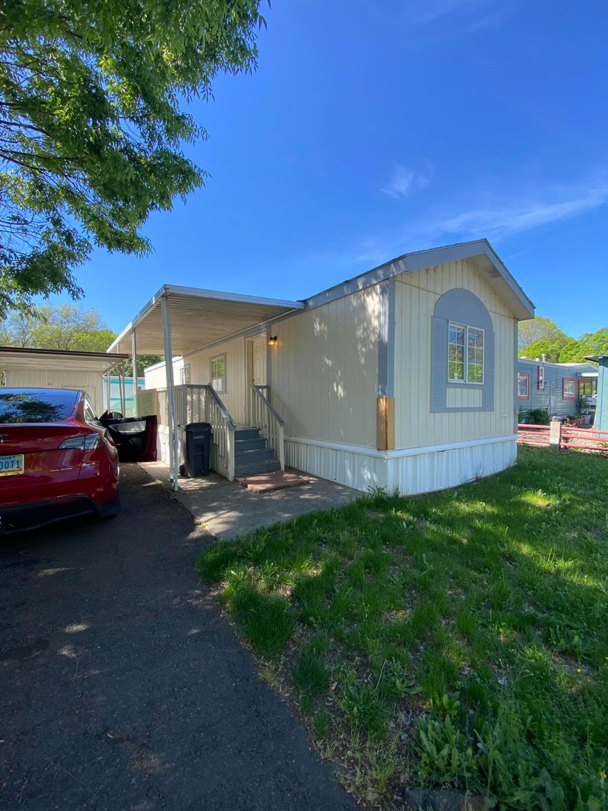 Seller will pay $1,000 towards Buyers Interest Rate Buydown at closing! Welcome to Space #63 located within the esteemed Rogue Valley Meadows, a 55+ community in the heart of Medford. This single-wide mobile home offers 2bd, 1 bth and 784 square feet of comfortable living space. Flooring has been updated and is ready for a new owner! Built in 1995, the bones are solid and home is move in ready. Park covers water, sewer and garbage. Owners pay for electricity. Available for a showing anytime. New owners must be approved by RVM with attached application.