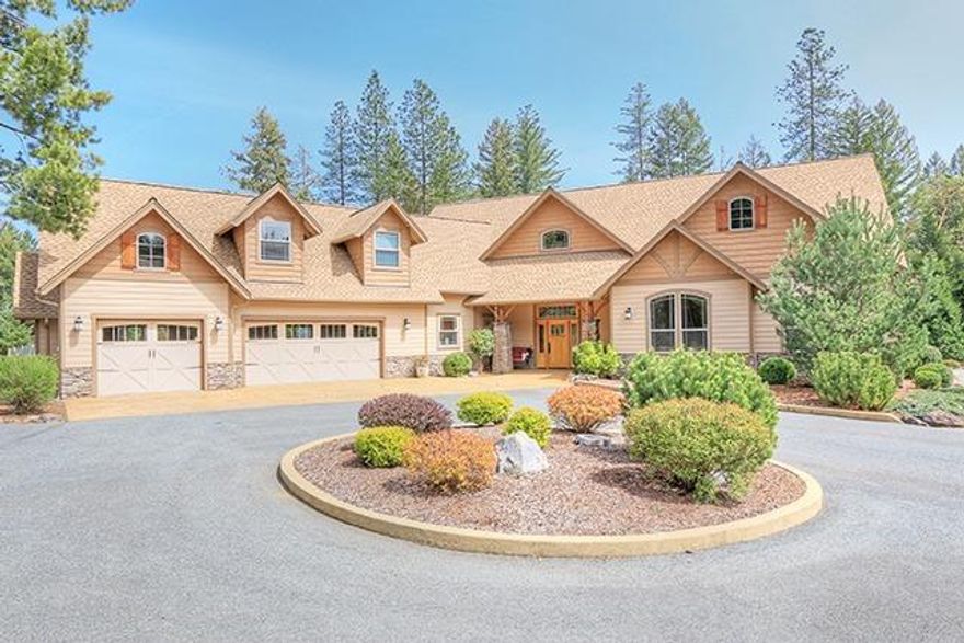 Featured in the Energy Star Home Tour! Master craftmanship is felt throughout this beautiful gated home built by Pete Reel Construction in 2009. Sitting on 3.09 level acres this home includes 4 bedrooms, 3.5 baths in addition to private guest quarters above the 3-car garage. Remaining living areas are on the main level & feature coved ceilings, transoms over every door, Thermador appliances, cross-grain custom cabinetry, central vacuum, and geothermal heat pump to name just a few of the upgrades in this meticulously built home. Sprawling entertaining spaces flow from the dining area to the covered outdoor living space featuring an exquisite propane fireplace. In addition to the landscaped backyard you will find a large, fully fenced garden area with irrigation connected to the sprinkler timer system. The oversized 2800 sq. ft. detached dream shop with 3 pull-through RV bays is plumbed for compressed air & has a thermostat controlled heater to keep your toys safe from freezing.