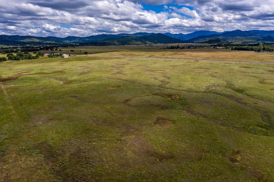Fabulous EFU property in a gorgeous location boasting 2 separate tax lots for a total of 30.28 acres of flat usable land! Incredible views in every direction. Tax lot 106 is 12.42 acres & tax lot 107 is 17.86 acres for a total of 30.28 acres. Fantastic opportunity here with heavy traffic on the corner of Riley Road and Hwy 140 across from Stoneridge Golf Course. There is no current homesite approval, irrigation, well or septic, this is raw land. Located in the Rogue River Valley Irrigation District but does not currently have irrigation rights and there is a waiting list. (Buyer to do their own due diligence on possible uses of property.) Possible Owner Carry don't miss this spectacular property!