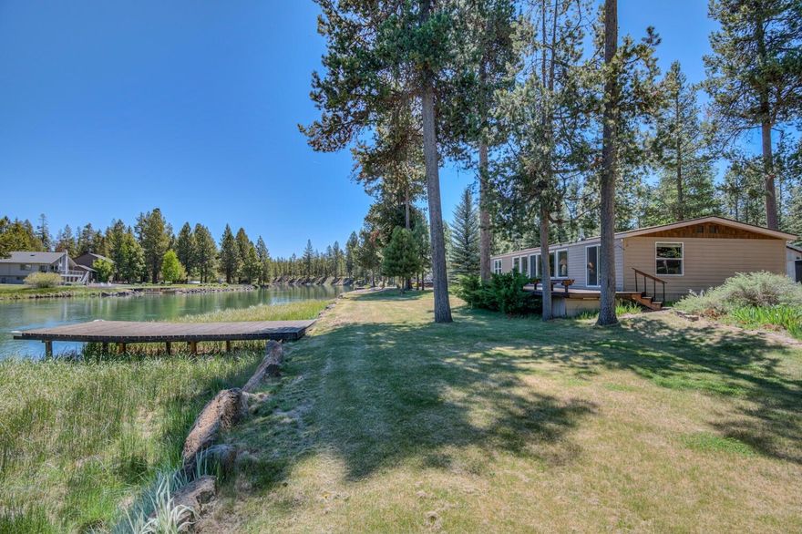 This is a one of a kind 1.03 acre lot on the Big Deschutes with Dock located in Oregon Water Wonderland on a paved street, community water and sewer. This home sets 40 feet off the River Bank giving it a unique grandfathered setback from the river. This is a 1980 2 bedroom 2 bath manufactured home offering 1344 sq.ft. of living and has been well cared for. There is a an 854 sq.ft. detached garage with an asphalt driveway. Just minutes away from Sunriver, Mt Bachelor and the High Cascade Lakes.