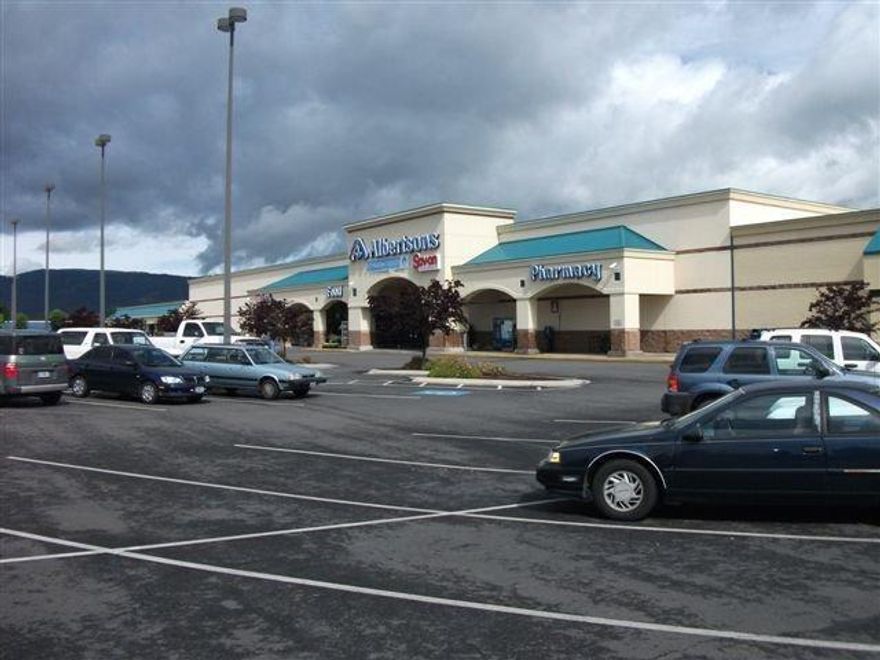 For Sale a 87,947 sq. ft. neighborhood shopping center on 7.16 acres. The center is anchored by Albertson's includes as tenants Subway, Perfect Look, Pucks Donuts, Lemon Grass Thai, El Arriero Restaurant, Sis-Q, Woolvies Floral, Jackson Creek Pizza, Creative Nails, Purple Parrot, Oregon Internal and Northwest Dental. Albertson's owns their 57560 square foot building and pays a land lease on the 4.23 acres. Upon expiration of the land lease and all options (4/30/2049) the building reverts to land owner. The parking lot in front of the Albertsons and building B are on leased property (Tax Lots 2500 & 2600) and the lease currently expires 4/30/2097. For sale with the center is another 30387 square feet of building referred to herein as buildings B, C, D, E, and F.