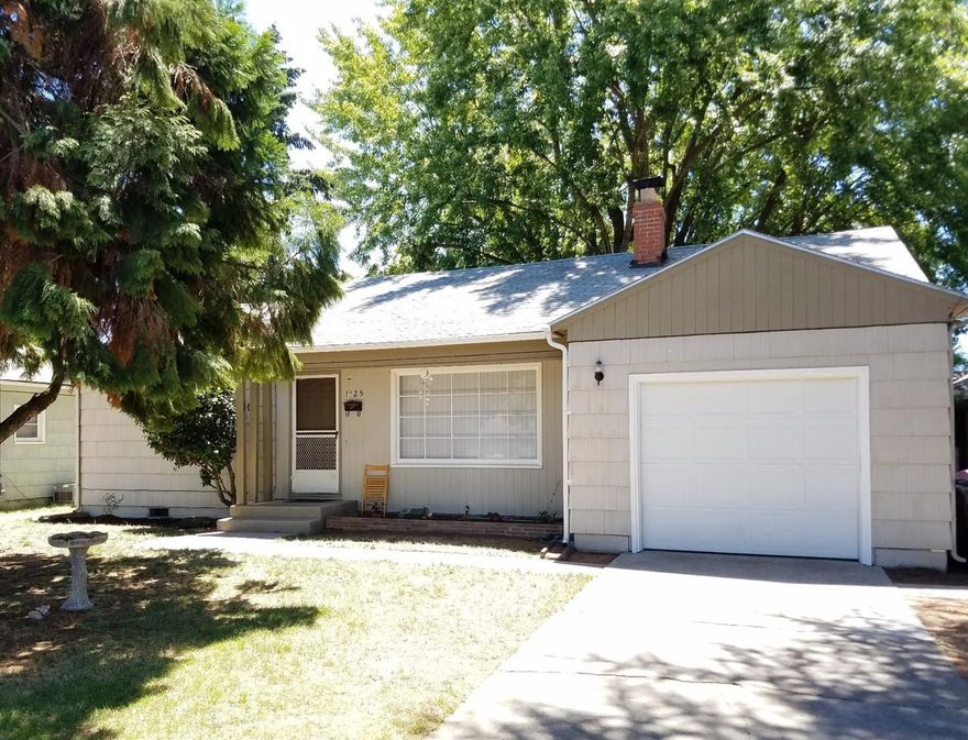Cute 3 bedroom on a large lot. Great first time home or investment. Craftsman style amenities, fireplace and updated bathroom. Large fenced backyard with gated alley access. Nice neighborhood close to schools and shopping. Please respect tenant's rights, easy showings by appointment. Act fast for a tour!