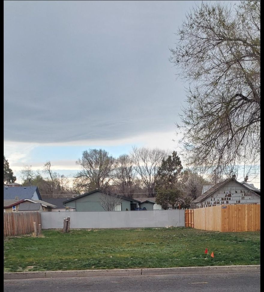 Flat, buildable lot, bring a manufactured home in or build a custom home. Lot is located near a park and library, three sides of it is fenced and utilities are in the street. City of Madras is giving a discount for lot development for a home under $240,000. No CC&R's or HOA's. Buyer is responsible for all due diligence regarding the lot and it's development. Lot is in flood zone.