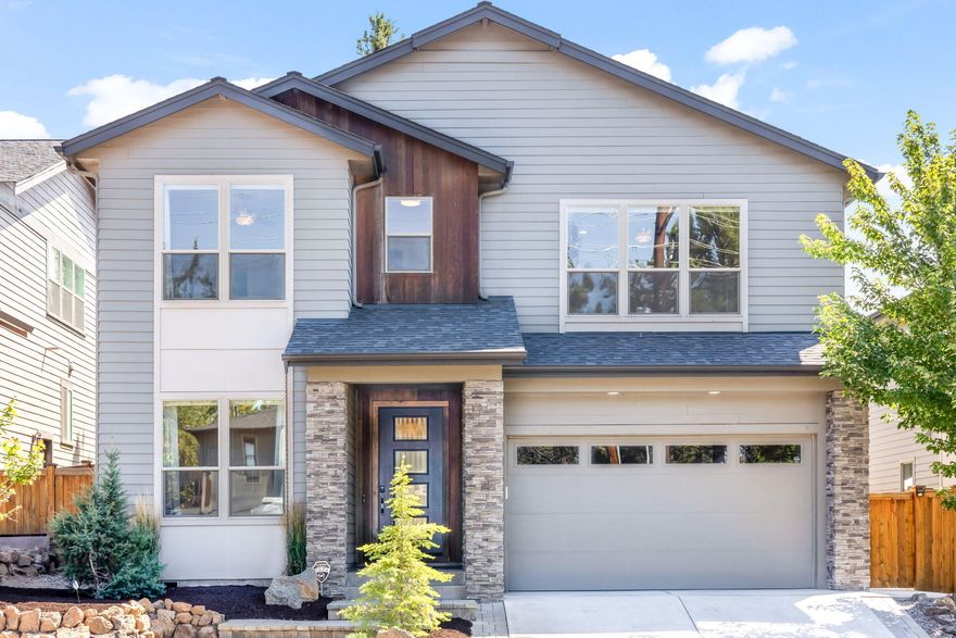 Discover the perfect blend of luxury + location in this stunning SW Bend home, sitting just above the Old Mill and the Deschutes River. This home is designed for both comfort + entertainment, featuring 3 spacious ensuites, ensuring privacy + convenience for everyone. The giant bonus room offers endless possibilities, while the main floor office provides the ideal space to work from home. Step outside to a patio made for entertaining, complete with a hot tub, established vegetable garden and a covered, lighted BBQ hut that's ready for year-round grilling! Inside, you'll find sophisticated black oak cabinets throughout, real hardwood floors that add warmth + elegance to the main floor, and LED lighting for a modern touch. With a laundry chute for added convenience, this home has thought of everything. This is a rare opportunity to own a home that combines thoughtful design, quality finishes, and unbeatable location. Don't miss your chance to experience the best of Bend living!