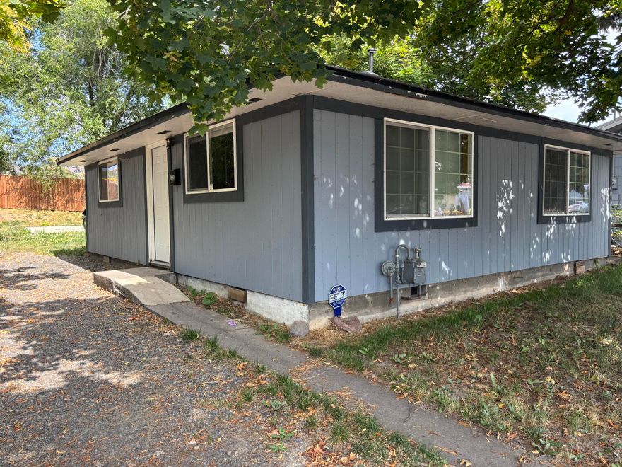 Super cute 2 bedroom 1 bath home next to the bike trail. Centrally located home with newer roof, flooring, kitchen and bathroom.  Beautiful hardwood floors.  Gravel driveway with ample parking. Established trees for nice shade.  Seller has done a recent price reduction as it does have termite damage on the sill plates and subfloor areas under the home.