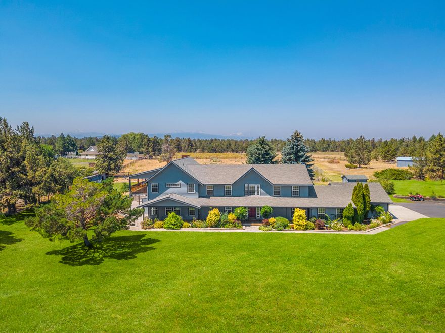 Just 15 mins to downtown Bend, 10 mins to Pine Nursery Park & 10 mins to the hospital, this property delivers an experience of living in serenity while offering convenient proximity. Set on 8 acres w/ 3 acres of irrigation, this updated home provides a primary suite on the main level, office, exercise room & kitchen designed to entertain. The second level creates space for all w/ a second primary suite w/ private balcony, multiple bedrooms w/ private vanities & large bonus room w/ access to a spacious covered deck. The park-like grounds provide opportunities to cultivate the fields for various hobby crops, poultry coup, shop & detached office w/ heating & cooling. The outdoor spaces embody the meaning of living in Central Oregon; w/ a hot tub, gas fireplace, sauna, multiple decks & patios to be enjoyed all year around. Plus, RV pad with water, power & sewer hookup. All this with beautiful Cascade Mountain views, inspiring sunrises, peaceful sunsets & no HOA!