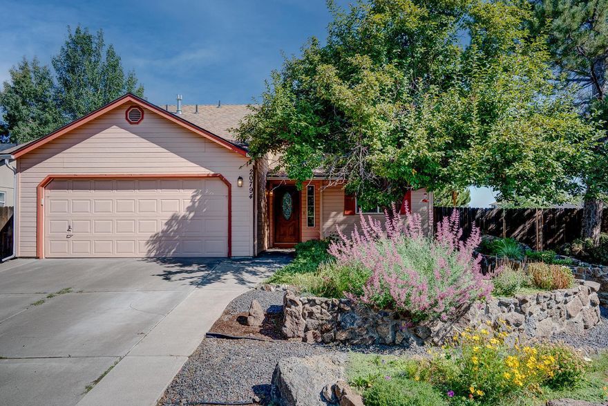 MOTIVATED SELLER! This two-story home in a great N.E. Bend neighborhood boasts 1612 square feet plus a 200 sq ft semi-finished bonus room! Being on a double-corner lot provides surprising privacy for a suburban neighborhood. This home sits on a 1/5-acre lot with a serene low-maintenance front yard, filled with trees, and perennials in beautiful raised-rock, irrigated beds, and a huge, fully fenced back yard with decks, raised garden beds with irrigation, and so much potential! Close to parks, shopping, and great schools. Central air to keep you cool all summer. Come make this one your own!
