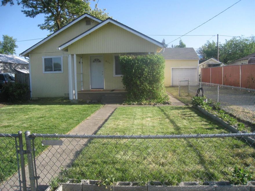 Charming cottage style home awaiting that special buyer to call this home. Comfortable 3 bedroom 2 bath home with some updates. Come sit on the front porch to start your day and sit on the back deck having a barbecue to unwind at the end of the day. Move in ready for that first time home buyer. 1 car attached garage with alley access to detached carport. Partially fence yard for easy maintenance. New heating, hot water heater and insulation in attic in 2016.