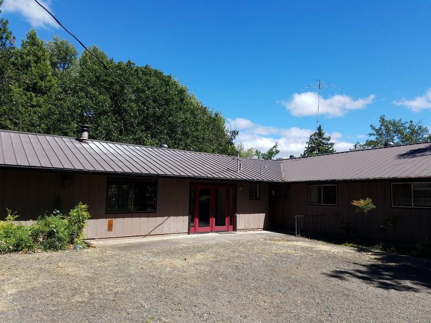 Lovely valley and mountain views from the spacious decks of this sprawling ranch style home. Private 2.4ac. irrigated property with mature shade trees and landscaping with lots of room for your 4H projects, gardens or other horticultural interests. Huge family room with beautifully rocked fireplace, updated large kitchen and dining area with lots of windows and natural light . Large private deck with wonderful vaulted roof. This wonderful home awaits your touches. Tons of parking for you tons, animals, gardens