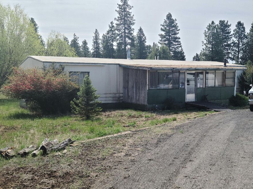 Beautiful 1.57 acres on corner lot, all fenced.  Has great out buildings. The home is in need of repair.  Sold ''As Is'' but is livable