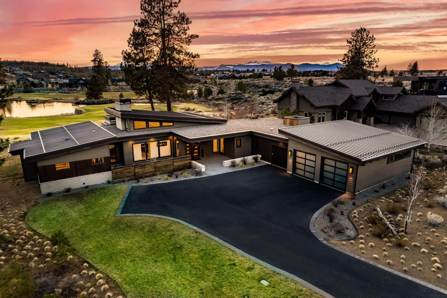 Beautiful single level custom built home with mountain views on Tetherow's 13th green overlooking the pond.