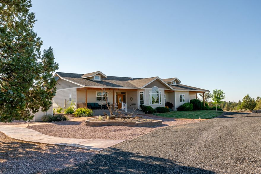 Uninterrupted Cascades views from Mt. Jefferson to Mt. Bachelor to the west and the east view gives you Smith Rocks.  Serene irrigated pastures  surround the home.  The very well built ICF home is efficient and quiet. Sealed concrete crawlspace.  Hickory floors or carpet with tile baths and heated primary bath floor.  Primary bath also has an antique clawfoot tub.  Double shower is doorless.  Large primary walk-in closet.  Wrap around deck to the west and open porch to the east.  Entry to primary bedroom includes double doors and a door to the deck and hot tub.  Built-in speakers inside and out.  Separate office from bedrooms.  Separate utility room. 52'x36' insulated and heated garage/shop with 10' high door. Space for 3-4 cars depending on use.  RV pad, hookup and room for toys galore.    Fenced garden with raised beds and greenhouse attached. Extra storage building.