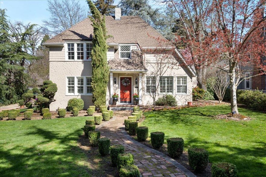 This enchanting storybook home boasts unique architectural details, including 3 gas fireplaces, arched doorways, beautiful handcrafted woodwork & built-in cabinetry, just to name a few. Warm & inviting living room w/abundant natural light. Kitchen has custom cabinets, quartzite counters, island, built-in refrigerator, breakfast nook & secret door that leads to the wine cellar in the pristine basement. Spacious main level master suite w/a spa-like en suite bathroom, featuring a deep soaking tub & elegant finishes. Upstairs you will find a spacious bedroom w/gas fireplace, cedar lined closets & door to huge upstairs outdoor space. 2nd guest bedroom & office are beautiful & filled w/natural light. Detached oversized 3 car garage w/bonus room upstairs. The private backyard is a serene oasis, complete w/deck, water feature, pavilion & quaint paths that evoke a sense of tranquility. Perfect for those seeking a fairytale retreat, this home combines old-world charm with modern comforts.