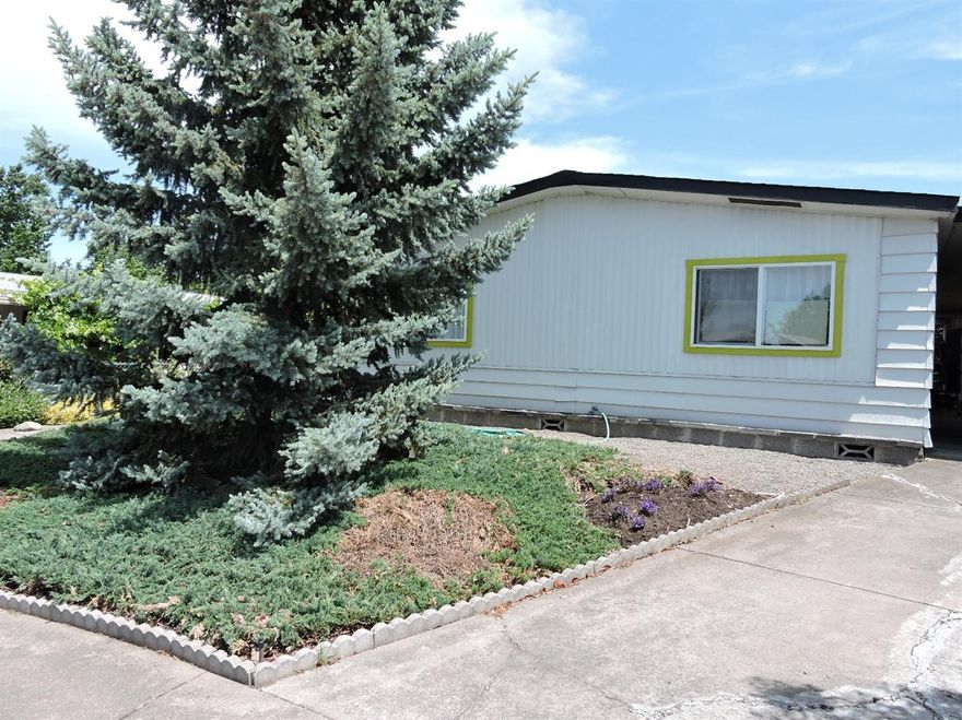 Spacious double wide mobile home in excellent condition. The owners has lovingly remodeled the home over the last several years. Nice cul de sac location on the south end of Talent. New flooring, paint, artistic touches throughout the home and is very comfortable. Office can be converted back to a bedroom. Large rooms with flexible floorplan. Nice flower and veggie beds, full length carport and storage shed.