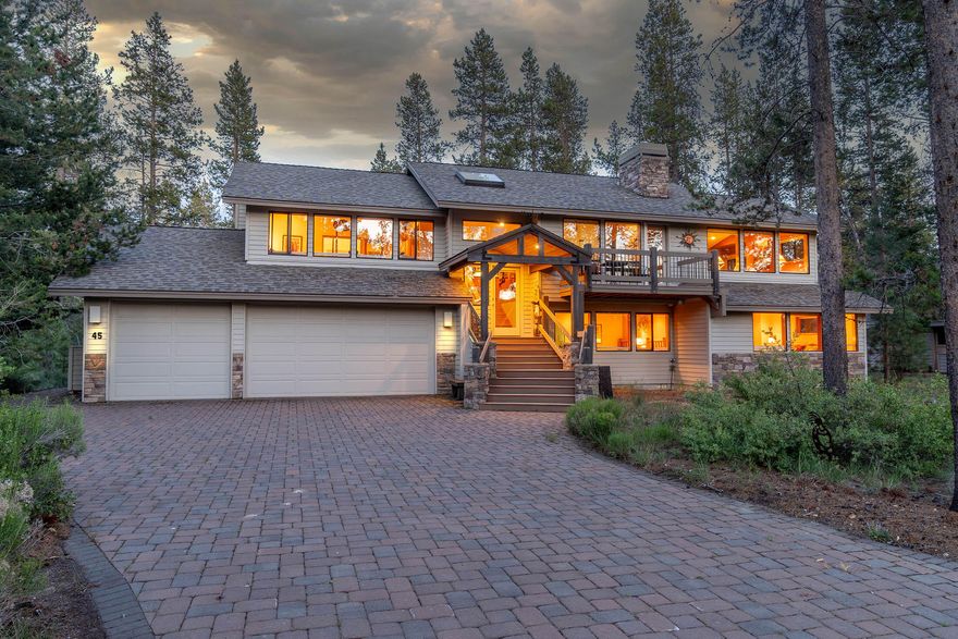 Come live the dream in Sunriver w/ so many things to do & experience. This split level features on the top level the heart of the home where entertaining is a delight w/ all the brightness of windows & gazing out towards the pines. You have a great & family room shared w/ a dual see-thru stone fireplace, vaulted ceilings, gleaming hardwood floors, ceiling fan, built-in cabinets & wood-wrapped windows. Spacious kitchen has huge center island w/ sink, ''Dekton'' counter tops, 5 burner stove, ''Bosch'' dishwasher, skylites & open to dining rm.  Primary bdrm is on upper level allowing complete privacy from guest suites which feature dual vanities, soaking tub & walk-in shower. Lower level are the 3 generous sized guest bdrms, 1 is an en-suite, laundry room w/ sink, cabinets & access to back. Check out the oversized 3 car garage while on this level. Enjoy outdoor entertaining on your massive ''Trek'' deck which could easily hold 20+ people for a BBQ. Enjoy soaking in your private hot tub!