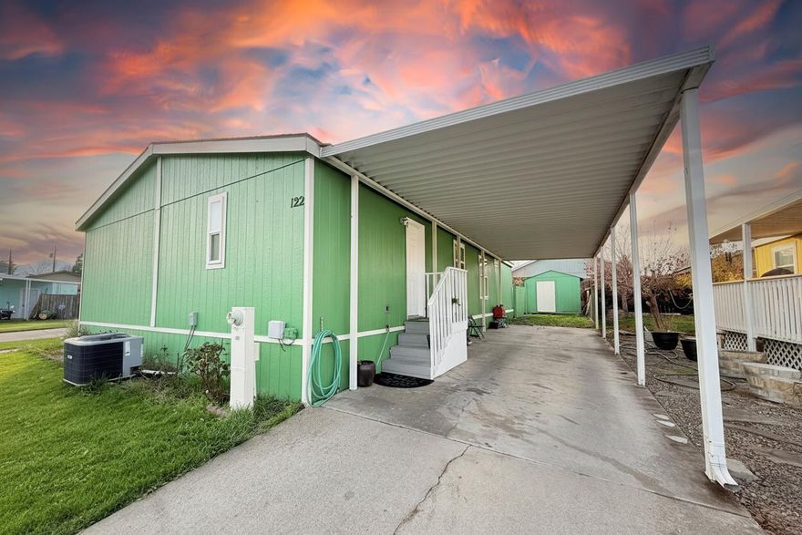 Don't miss the chance to own this well-maintained manufactured home. It features a 1-year-old air conditioner, laminate flooring throughout, and epoxy countertops. The interior and exterior were painted just last year, and the vinyl windows were replaced about 4 years ago. The roof is only 3 years old, giving you peace of mind for years to come.

Outside, you'll find a 2-car carport, a covered porch, and an additional porch on the other side—great for relaxing or extra outdoor space. There's also a large shed, perfect for storage or projects.

The spacious backyard offers plenty of room to enjoy and includes cherry and peach trees.
A clean, updated home that's ready for you!