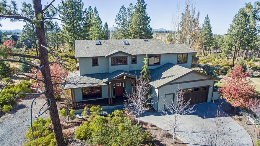 Custom craftsman-style home situated on nearly an acre in one of Bend's most coveted neighborhoods. Located on a private road with trail access close by, minutes from downtown Bend and in proximity to Mt Bachelor, this is Central Oregon living at its best. The interior features high quality, timeless details and finishes throughout with a slate tile entryway, vaulted ceilings, alder wood trim, walnut hardwood floors, concrete countertops and built-ins in both main floor living areas. Upstairs are 4 bedrooms plus a spacious office. 4th bedroom has surround sound and can also be used as a media/bonus room. Generous windows and skylights provide abundant natural light and bring the serene outdoor surroundings in. A large covered deck extends the living space outside, where you'll also find several patios, a hot tub, fire pit, a large yard and chicken coop/shed with power and water. Double garage with additional shop area and room for outdoor RV parking. No HOA.