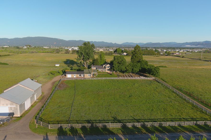 Two grandfathered homes on 15 acres with 14 acres of irrigation. Large Barn / Shop & feed barn. Main House: YB 1900 - 3491 SF 5 bed 3 bath Remodeled in 2007 - new roof, heated floors in two bathrooms,on demand water heater, large two person spa tub, new pipe, electric, insulation, replaced all windows with double pane except large window in living room, new kitchen - granite counter tops, custom cherry wood cabinets top of the line stainless steel appliances. Living room:new fire place insert, irreplaceable wood flooring, lighted tray ceiling. Sound system throughout the house and patios.Second home: YB 1907 694 SF totally remodeled new kitchen stainless steel appliances. New windows and flooring. Outside: Large shade trees, 14 orchard trees for the family include apple, pear, plum and apricot. Huge vegetable garden with 18 raised beds. Over 60 rose plants. Under ground pipes replaced two years ago. Two wells, one is exclusively for the lawn and garden.