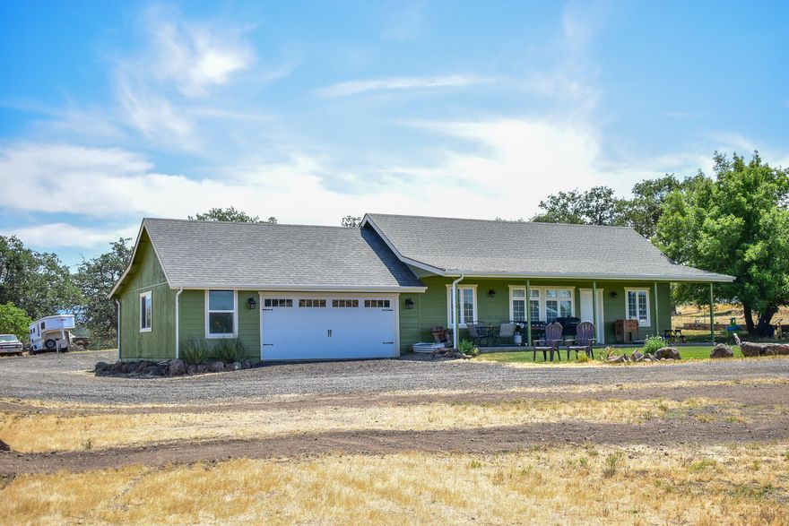 Incredible opportunity to own this single story home, built 2013, with 2 roomy bedrooms + office (office soon to qualify 3rd bedroom with Jackson County), and 2 full baths, on flat fenced 5 acres, with incredible views! A beautiful piece of the Southern Oregon lifestyle includes a 784sf attached oversized garage, a smattering of smaller outbuildings, a covered front porch, and an automatic gate! Recent well test 15.5 gpm, and septic pumped! The lot has trees on the back portion of the property, but is cleared in the front, and around the house. The home sports an Open Concept kitchen and living space, the Primary bedroom large enough for a king-sized bed, with its own attached private bathroom space. Don't wait to make this country cutie yours! Appointment only, but easy to show. Drive by ok but don't go on driveway or disturb occupants. Back on Market at no fault of property.