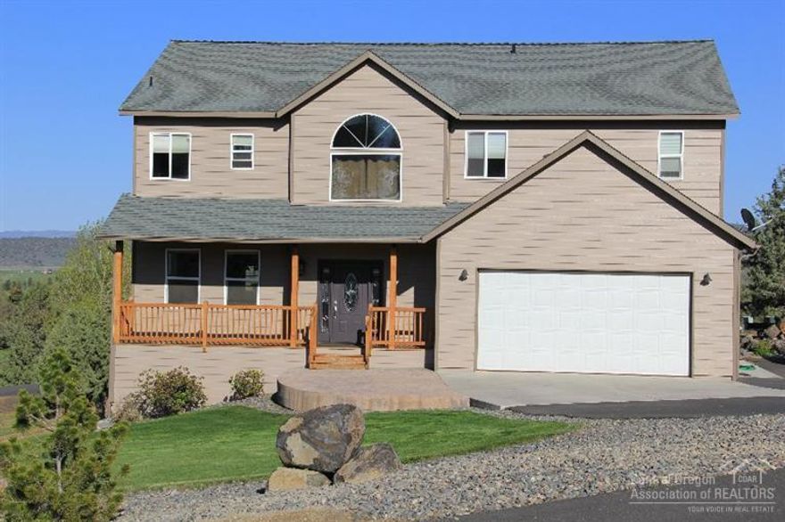 Looking for space indoors and out?!?! This 3770 Sq Ft 4 Bed, 3 Bath home offers a living and family room, granite tile in the kitchen, amazing vault in the living with windows galore! Full basement with walk out and a room that could also be used as another bedroom. Double car attached garage, forced air with A/C, beautifully manicured on a corner 1.06 acre lot just on the outskirts of town.